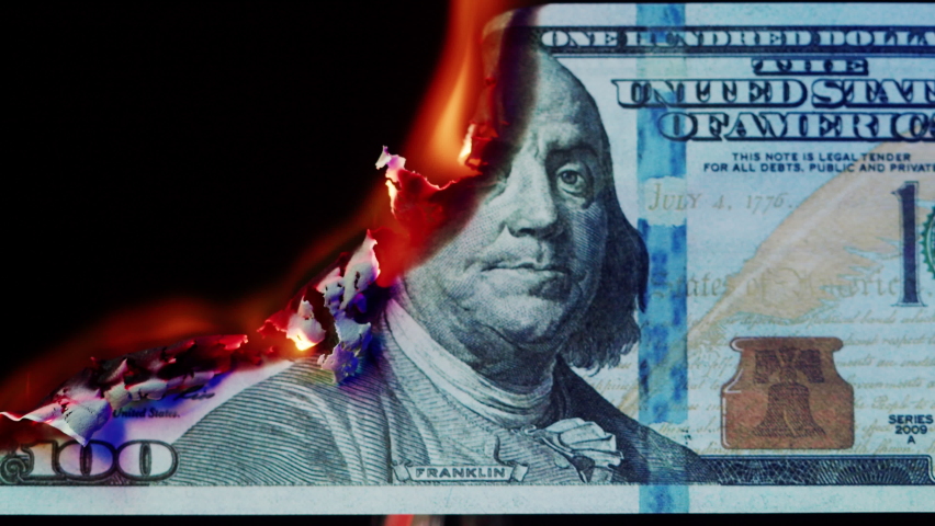Burning American hundred dollar banknote on black background. Flame of fire from cash close-up. Financial crisis and depressed economy. Paper money loss concept.  Royalty-Free Stock Footage #1085499245