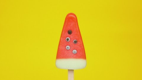 Melting Cold Ice Cream in Summer Heat - Isolated Watermelon Popsicle melts in Sunlight - Cool Refreshment Summertime