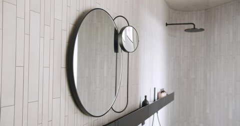Modern White Bathroom with round mirror, minimalist shower cabin. contemporary.