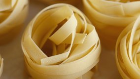 Raw Italian Pasta tagliatelle, rotation. 4K UHD video