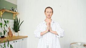 Young woman going yoga exercise at home. Health care online lessons. Indoor meditation workout. Check phone interrupt concept. Addiction to gadgets. Female person lifestyle. Asana pose