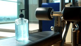 Alcohol gel or hand sanitizer for cleaning hands in gym. Hand wash soap to protect from COVID-19 coronavirus pandemic in new normal fitness gym. Healthcare lifestyle. Preventive measures in epidemic - Powered by Shutterstock - Get 15% off with code: PIKWIZARD15