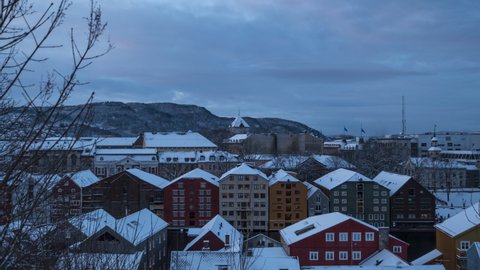 Beautiful Architecture and Boathouses in a riverbank in Trondheim, Norway. Dark Blue Skies Moving across the city. Timelapse.
