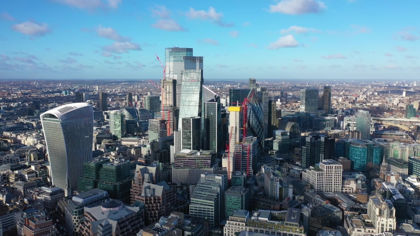 Aerial drone video of iconic landmark skyline skyscraper buildings in financial area of City of London, United Kingdom