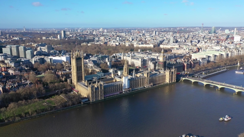 Aerial drone video of iconic City of Westminster with houses of Parliament, Big Ben and Westminster Abbey in front of river Thames, London, United Kingdom Royalty-Free Stock Footage #1085523059
