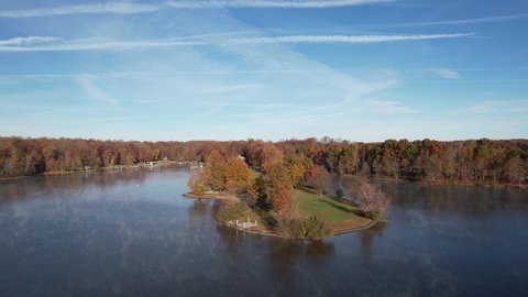 Aerial Drone View of Lake Anna with Fall Trees with Foliage along the Shore 