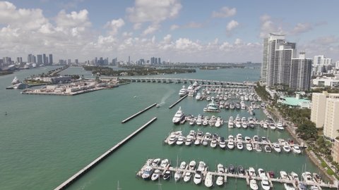 Low aerial flyover: Miami Beach Marina with Biscayne Bay seen beyond