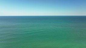 Blue sky and ocean horizon aerial drone video