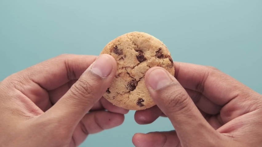Slow motion of eating chocolate chip cookies  | Shutterstock HD Video #1085545430