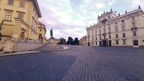 Prague, Czech Republic - JULY 12, 2021 : View to Prague Castle and Cathedral of St. Vitus from Hradcany Square. Morning time, area without people. Steadicam shot.
