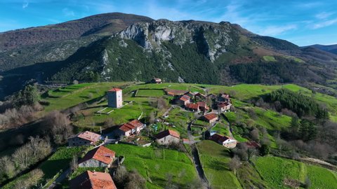 Aerial view of the Tower of Rubin de Celis and the church of San Facundo in the Town of Obeso in the Municipality of Rionansa. Cantabria, Spain, Europe