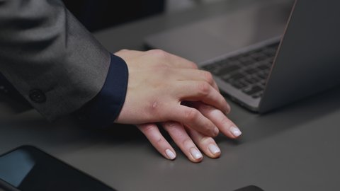 Sexual harassment problem. Close up shot of unrecognizable woman working at office, lustful man colleague touching her hand, irritated lady pushing him away, slow motion