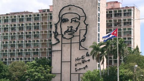 HAVANA,CUBA-March, 2014 Wide shot of the interior Ministry Building in the Revolution Square, featuring the Cuban flag and a Che Guevara work of art.