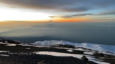 Dawn in the mountains. Stunning mountain landscape. Melting glaciers of Kilimanjaro. Beautiful sky. Climbing Kilimanjaro in December, Tanzania, Africa.