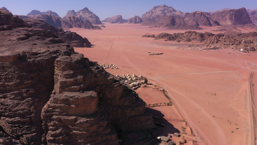 Aerial view of a luxury camp in the inmenso desert of Wadi Rum in Jordan | Shutterstock HD Video #1085572370