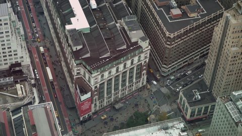 NEW YORK, USA - OCTOBER, 24, 2021: Macy's shopping center store building outdoors. Red logo and star on facade. Summer day at Manhattan in NYC. Aerial view.