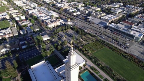 Mormon Temple Church of Jesus Christ of Latter Day Saints Century City, Los Angeles California, aerial orbit tilt-up.