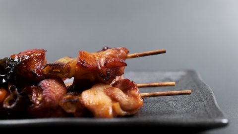 Grilled chicken on a skewer "yakitori" on a plate, Food background
