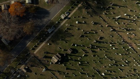 Aerial birds eye overhead top down view of rows of gravestones on historic Calvary Cemetery. Queens, New York City, USA