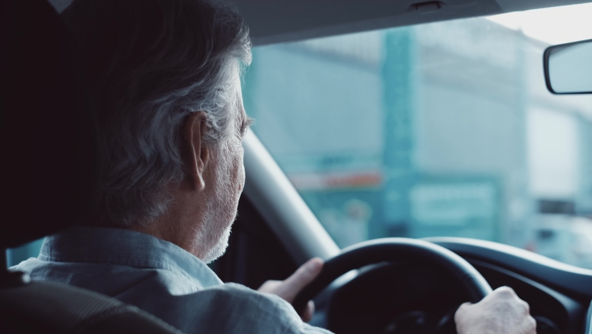 Stressed old businessman feeling headache in car, stop the car, keeping hand to head and feeling anxiety.
 Royalty-Free Stock Footage #1085593352