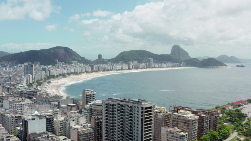 Aerial view Rio de Janeiro Brazil. Downtown cityscape with copacabana beach in mountain scenery, city areas, favelas and mountain ranges.