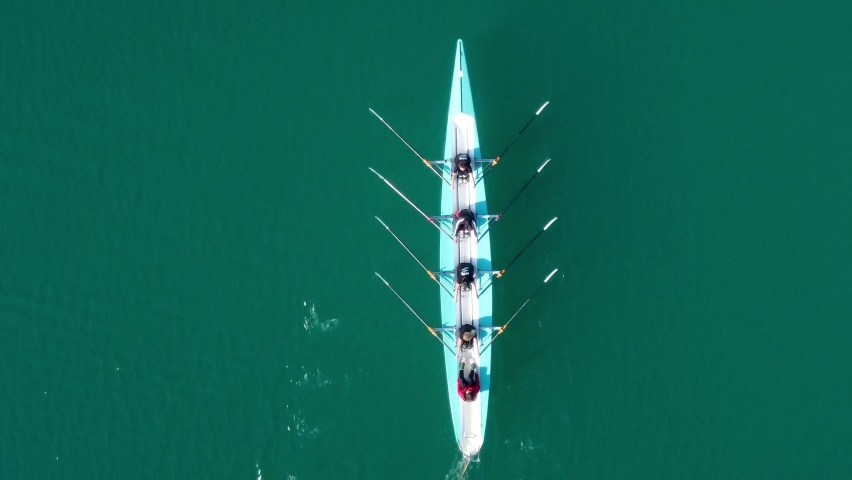 Aerial drone bird's eye view video of two sport canoe operated by team of young men and women  Royalty-Free Stock Footage #1085609021