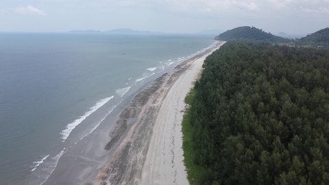 4K in aerial view over Laem Son National Park with wave beach and lot of pine trees in the park's beach area. Laem Son National park is locate in Kapur District, Ranong, Thailand