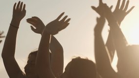 Celebration summer day at beach party. free girls are dancing cheerfully on a summer evening at sunset. healthy teenagers having fun raise their hands up. - Powered by Shutterstock - Get 15% off with code: PIKWIZARD15