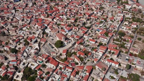 Aerial view traditional village of Cyprus, orange shingles roofs. Pano Lefkara, Church