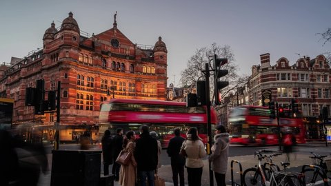 LONDON, ENGLAND - JANUARY 17, 2022: Cambridge Circus time lapse. Time lapse shot at dusk showing The Palace Theatre on Shaftesbury Avenue in the West End of London.