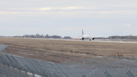 Kyiv, Ukraine - 16 JAN 2022: Airbus 321 of the Lufthansa company takes off at Boryspil International Airport. Snowless winter, cloudy, windy.