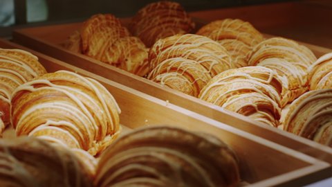 Concept of small business and entrepreneur in the coffee shop closeup capturing fresh baked french croissants