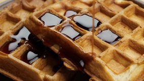 Pouring maple syrup on waffles macro - Powered by Shutterstock - Get 15% off with code: PIKWIZARD15