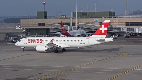Swiss airplane Airbus taxiing at Zürich Airport on a sunny winter day. Movie shot January 19th, 2022, Zurich, Switzerland.