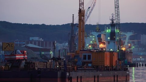 Gdynia, Poland - circa August 2019: Night work in the ports of Gdynia - loading, unloading, repair.