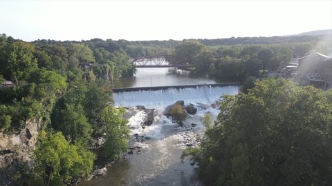 beautiful Waterfall and bridge in drone shot during lush summer in upstate NY