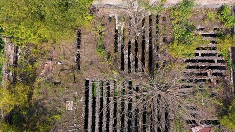 Ruined lost overgrown mining ghost town Akarmara, consequences of war in Abkhazia, aerial view from drone