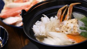 Video of crab pot. Japanese food in which vegetables and crabs are simmered in soup.