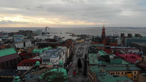 Aerial rising over picturesque city of Helsingborg on cloudy day, Sweden