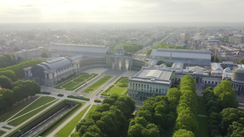 Inscription on video. Brussels, Belgium. Park of the Fiftieth Anniversary. Park Senkantoner. The Arc de Triomphe of Brussels (Brussels Gate). Glitch effect text, Aerial View