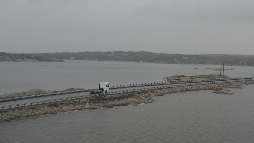 Truck driving by the sea