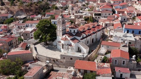 The Church Of Holy Cross in Pano Lefkara, Cyprus. Aerial view, fly over roofs