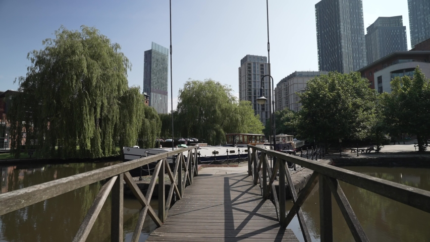 Shot along walk bridge (footbridge) in Castlefield Marina, Manchester, Lancashire, England, United Kingdom, Europe