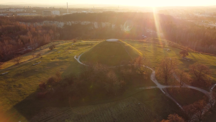 Amazing panoramic sunset aerial drone view of the Krakus Mound (Kopiec Kraka) located near Krakow, Poland.