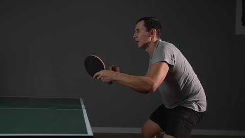 table tennis. man a athlete playing ping pong. sport party tournament concept. sportsman man training playing table tennis. lifestyle forehand and backhand exercise in ping pong