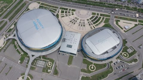 Almaty, Kazakhstan - May 6, 2020: Flight over Almaty Arena on a bright sunny summer day. New sports facility in the city of Almaty from above. Aerial top view.