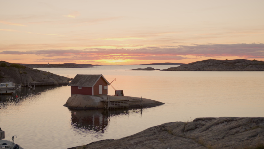 House on small island sunrise
