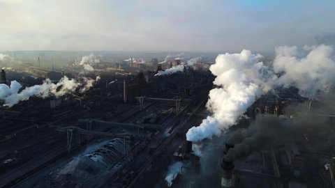 metallurgical plant smoke from chimneys shooting from a drone from a height ecology