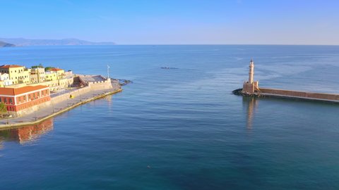 Chania harbor Crete Greece. Blue sea and old lighthouse on port entrance
