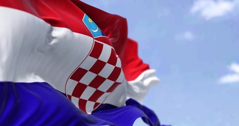 Detail of the national flag of Croatia waving in the wind on a clear day. Democracy and politics. Patriotism. European country. Selective focus. Seamless Slow motion